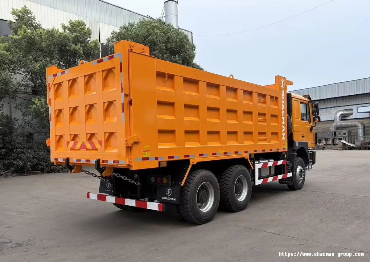 Orange SHACMAN F3000 6x4 dump truck rear side view with SHACMAN logo