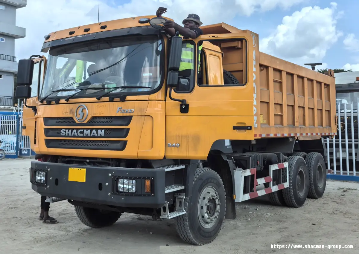 Yellow SHACMAN F3000 6x4 dump truck with driver for sale in Uganda