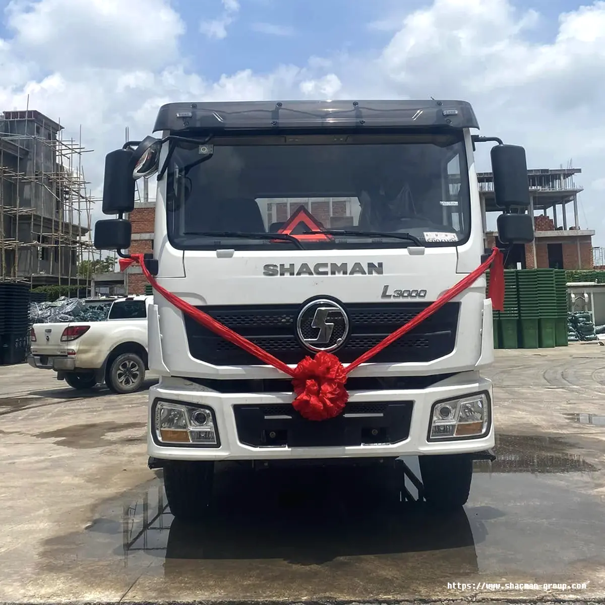 White SHACMAN L3000 truck front view with red ribbon for delivery in Uganda