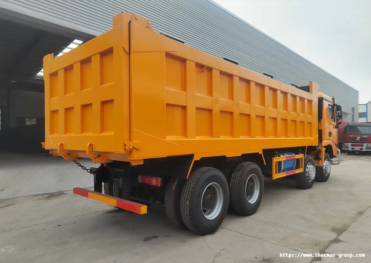 SHACMAN X3000 dump truck rear view with orange cargo box