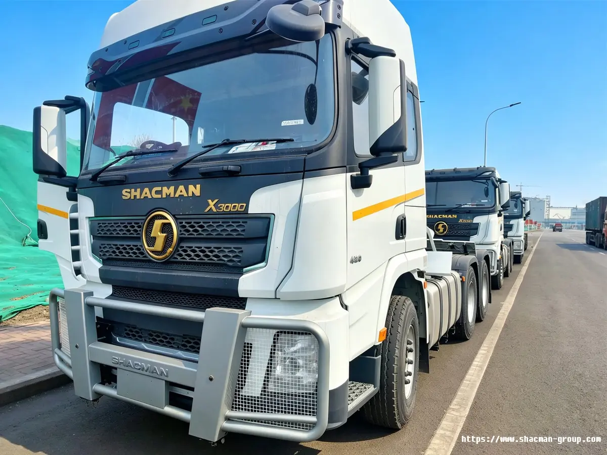White SHACMAN X3000 6x4 tractor truck with front guard and gold logo for sale in Uganda