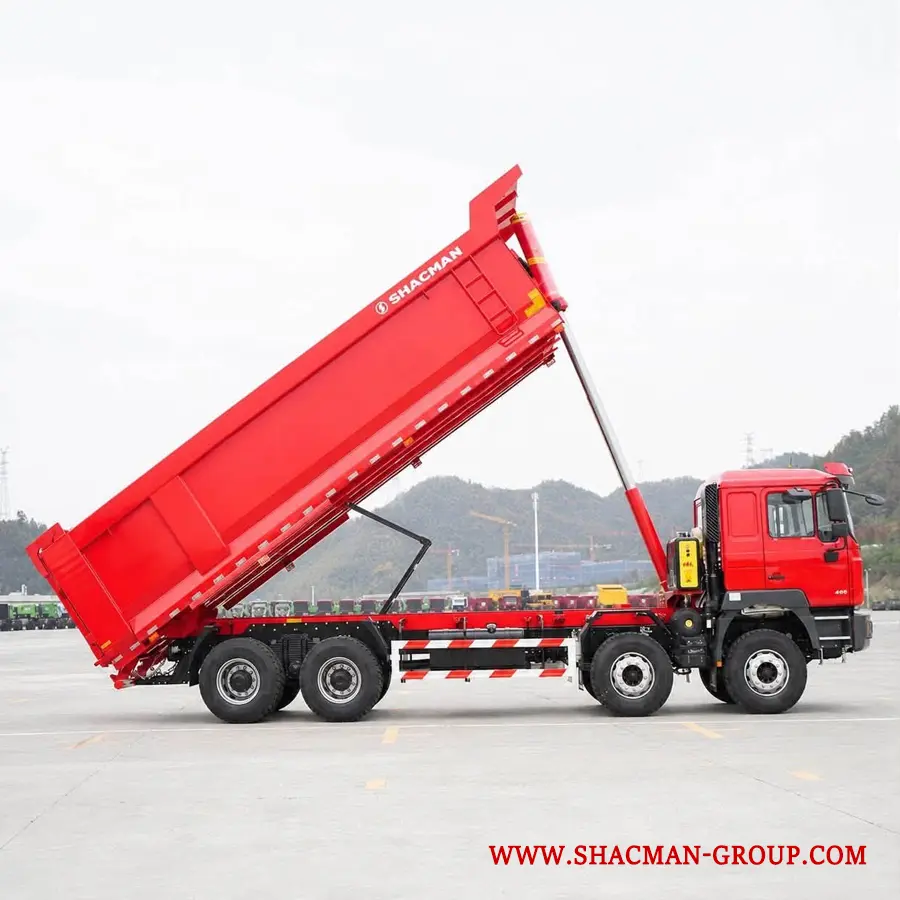 Red Shacman F3000 8x4 dump truck for sale in China, parked at an export yard.